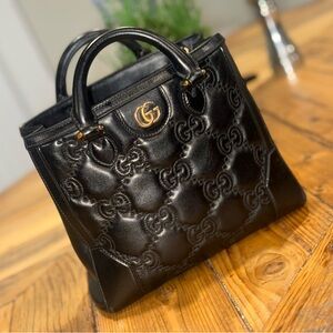 Gucci GG matelassé
mini top handle bag
